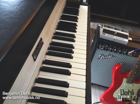 A Fender Rhodes electric piano, a Fender Blender effects pedal, a Fender Twin Reverb amplifier and a Fender Stratocaster electric guitar